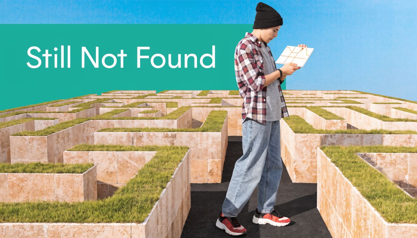 A person wearing a beanie stands in a large outdoor maze holding a map, feeling lost.